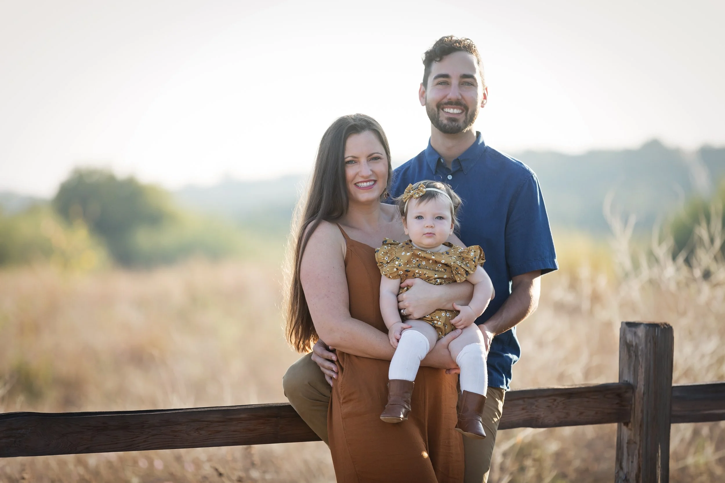 family-portrait-on-fence-at-commons-ford-ranch-austin.jpg