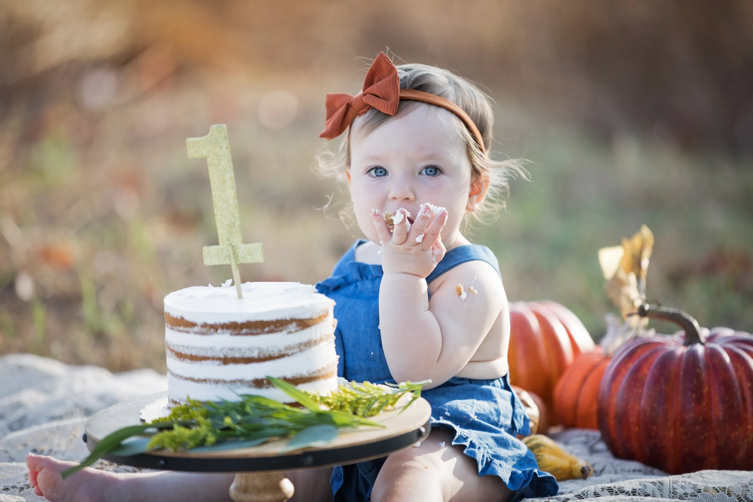 baby-clapping-during-outdoor-cake-smash-austin.jpg