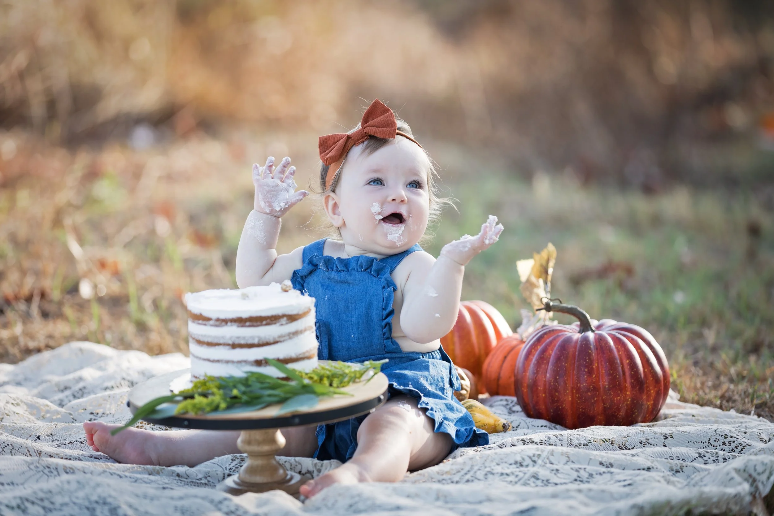 baby-clapping-during-outdoor-cake-smash-austin.jpg