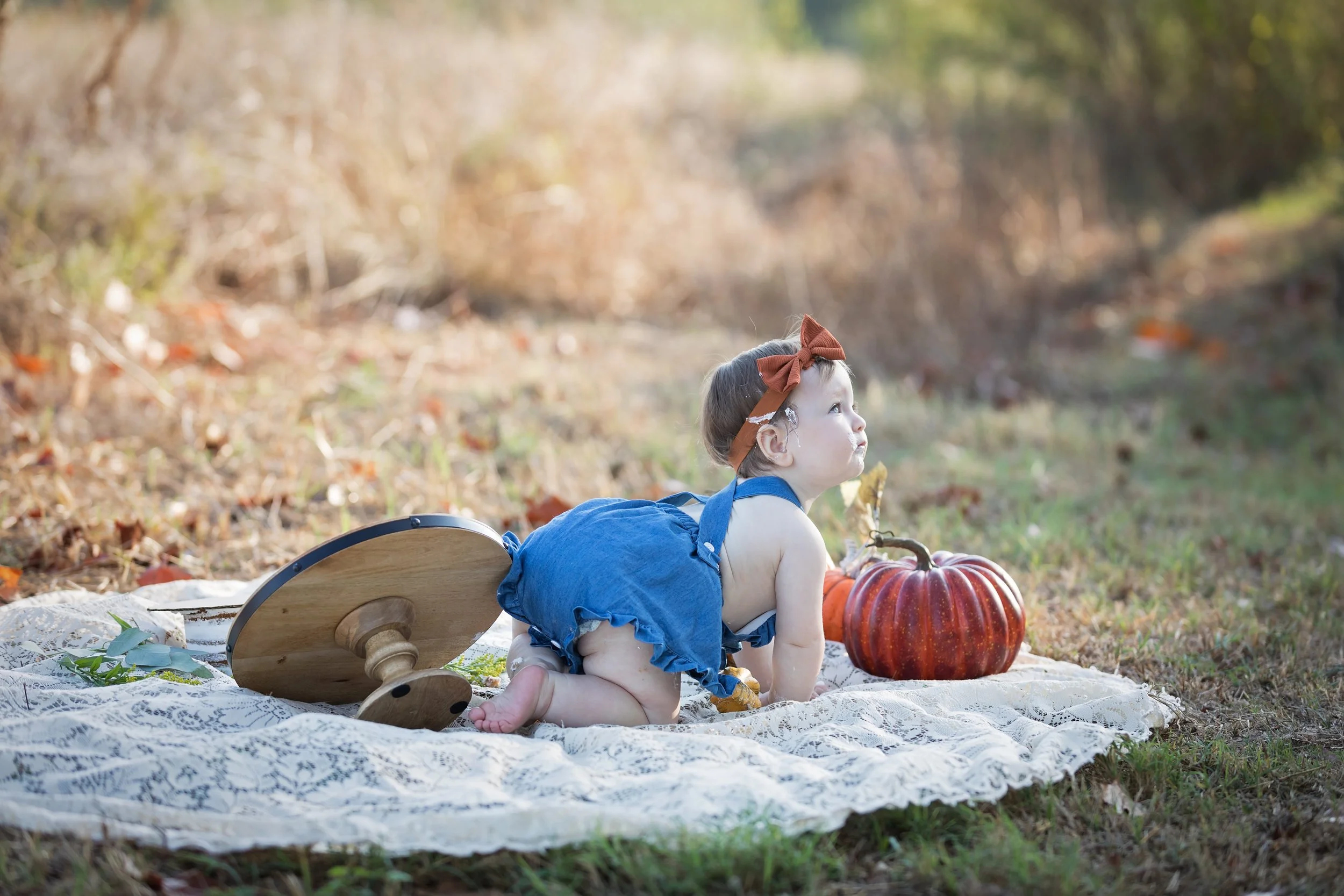 baby-crawling-away-after-outdoor-cake-smash-austin.jpg