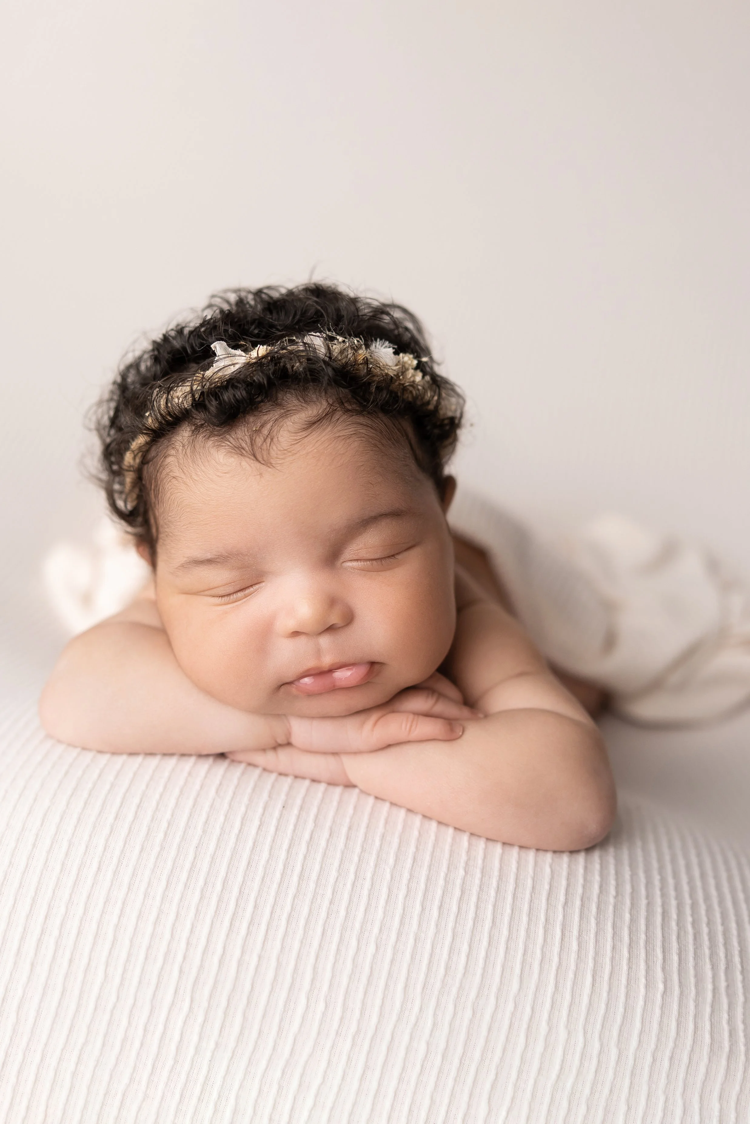 Close-up newborn portrait highlighting the tiny details parents never want to forget.