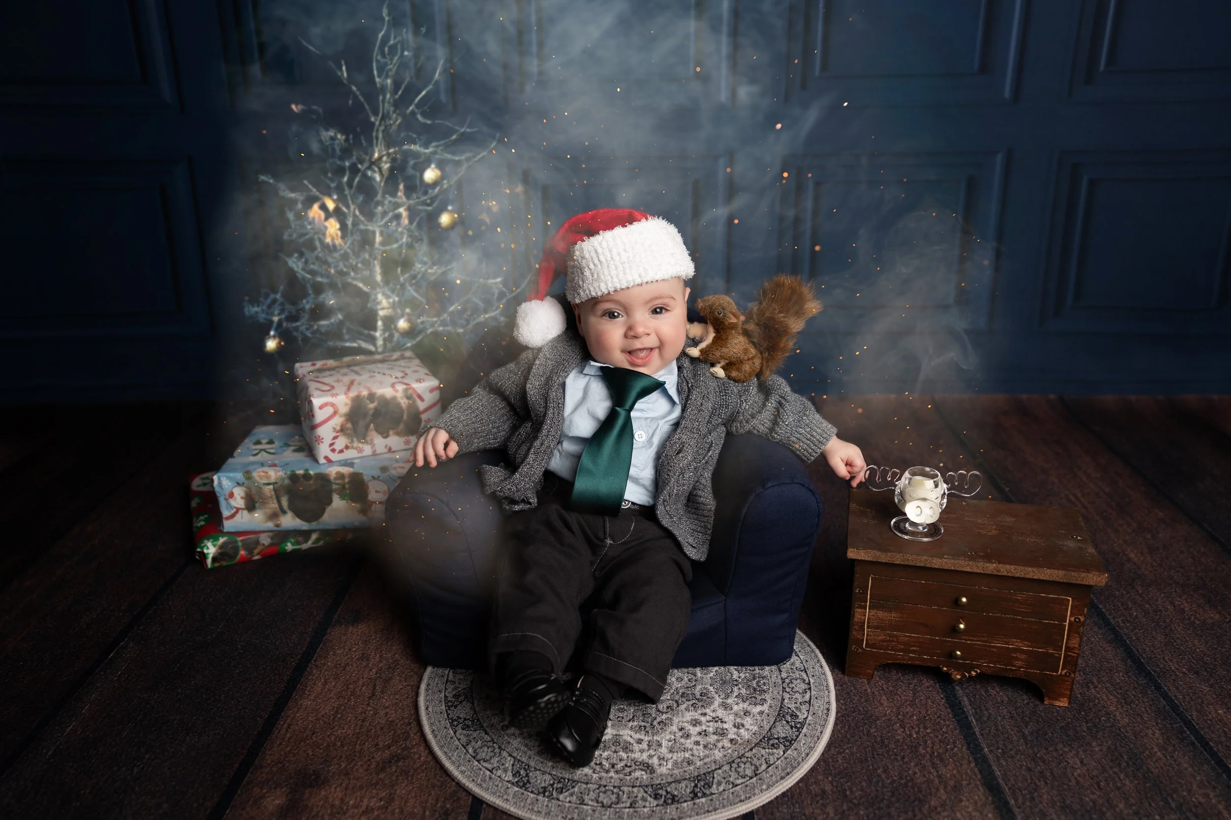 Creative Christmas Vacation-inspired baby portrait featuring festive props inspired by a family's favorite holiday movie.
