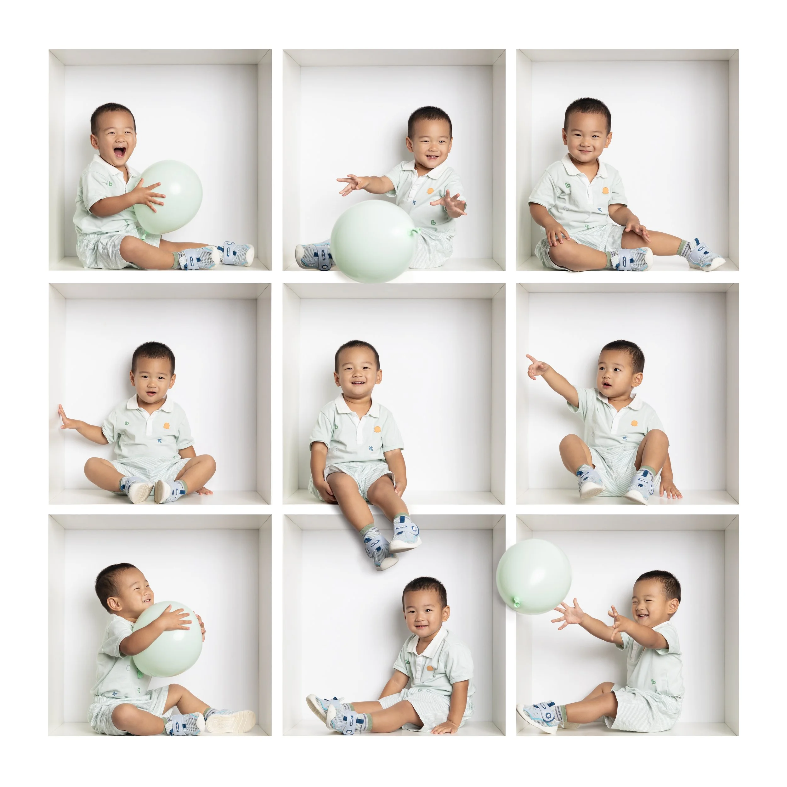 toddler boy playing with balloon in-the-box session