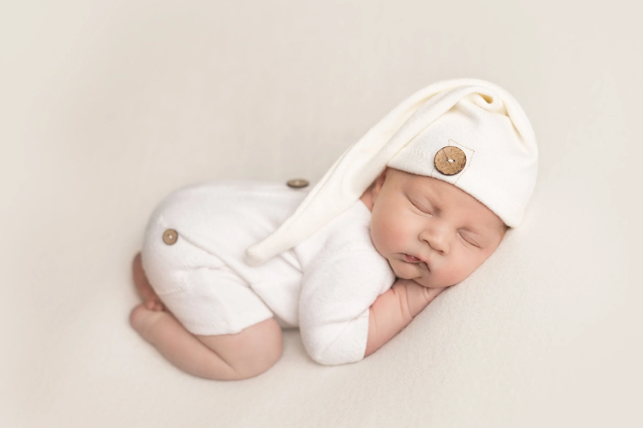 Sleeping newborn photographed during a studio newborn session in Austin, Texas.