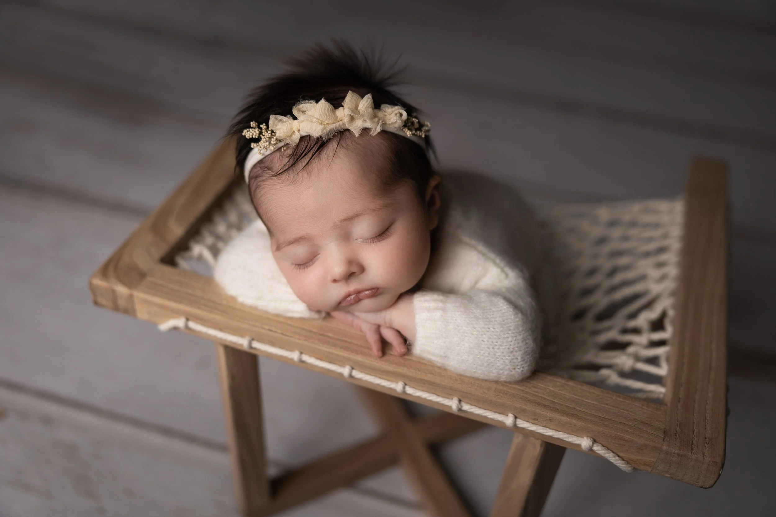 Austin newborn photographer studio session with baby girl in neutral styled setup