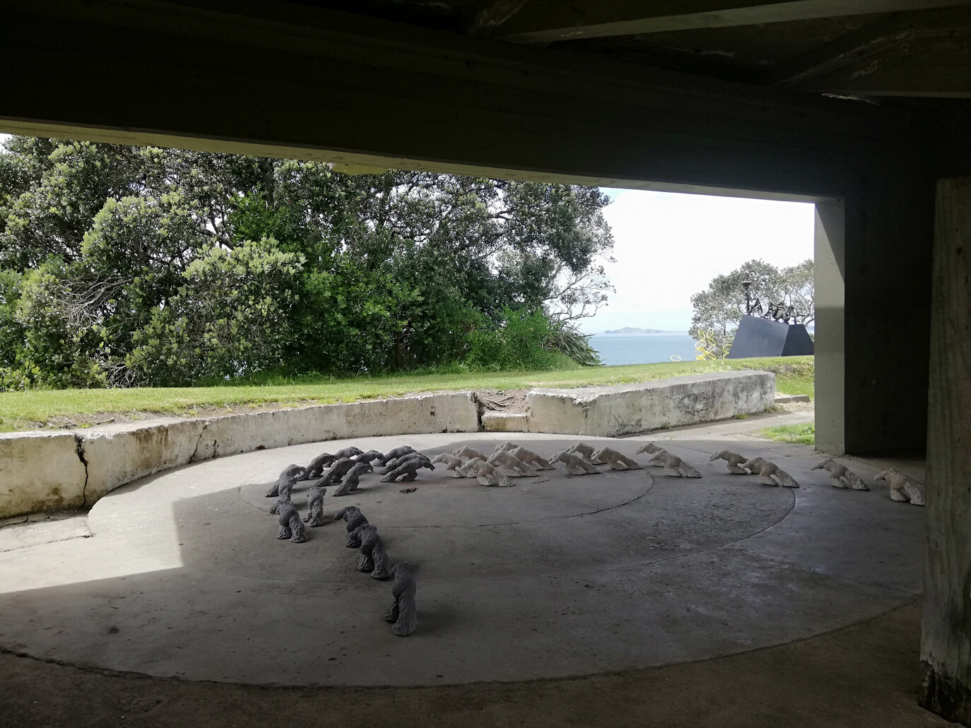 The transfixion of light and dark' (2018)  -site specific -silicon casting, ciment fondu, silica sand, builders sand, fiber glass; (200mmH x 150wmmW x 450mmL) x 30 figures (15 natural and 15 slightly oxidised), Sculpture on the shore, Auckland