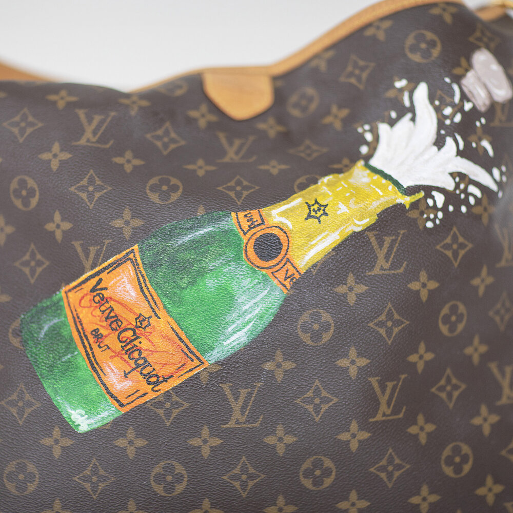 champagne bottle painted on customer's own bag — art & soul
