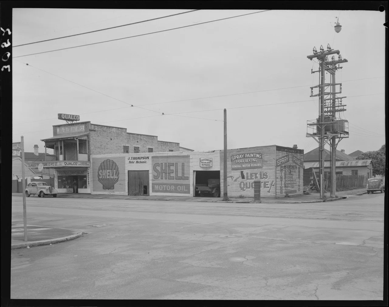 Shell motor mechanic and Qualco furniture on the corner of Melbourne Street, West End - 1952