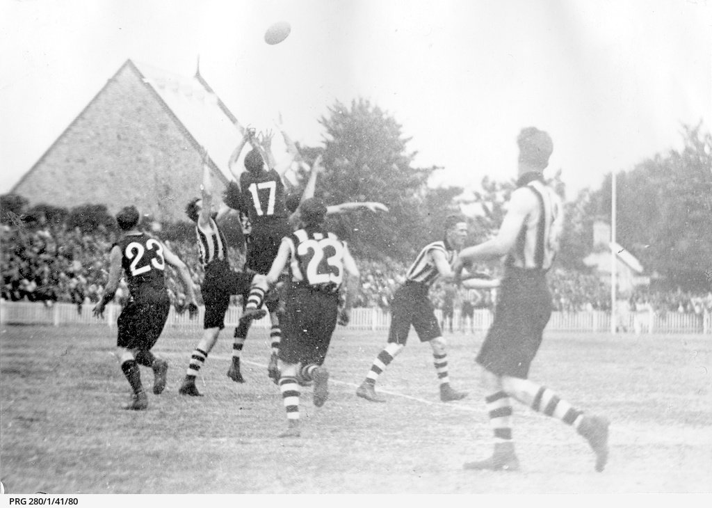 Close view of players in a football match between Norwood and Port Adelaide which is being played at Norwood 1923