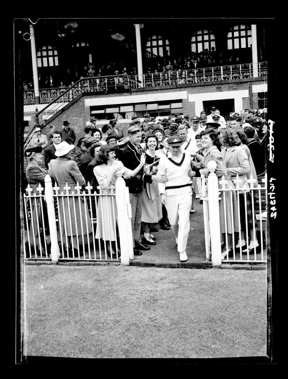 Don Bradman, leading his team onto the field at the start of Bradman Testimonial match, Melbourne, December 1948
