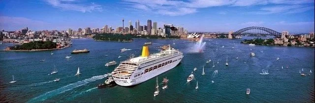 Sydney Quay with Modern cruise ship Oriana, ferries and Harbour Bridge