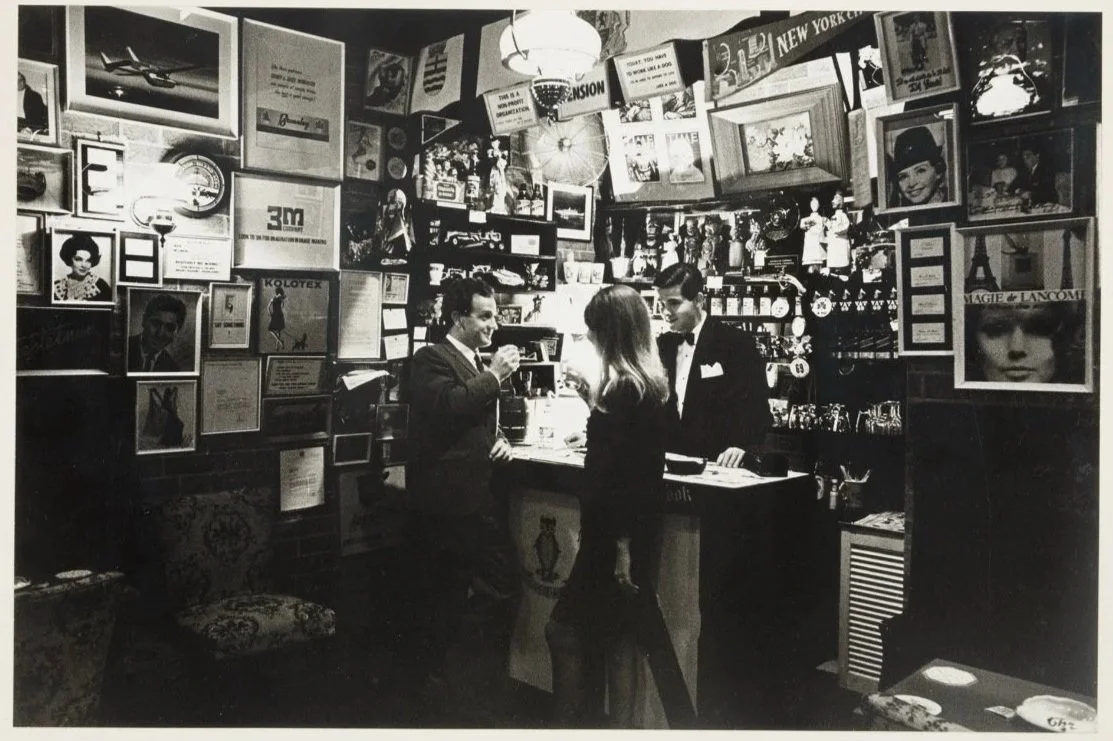 Couple at the bar and dining under chandelier, Chelsea Restaurant, Dec 1966