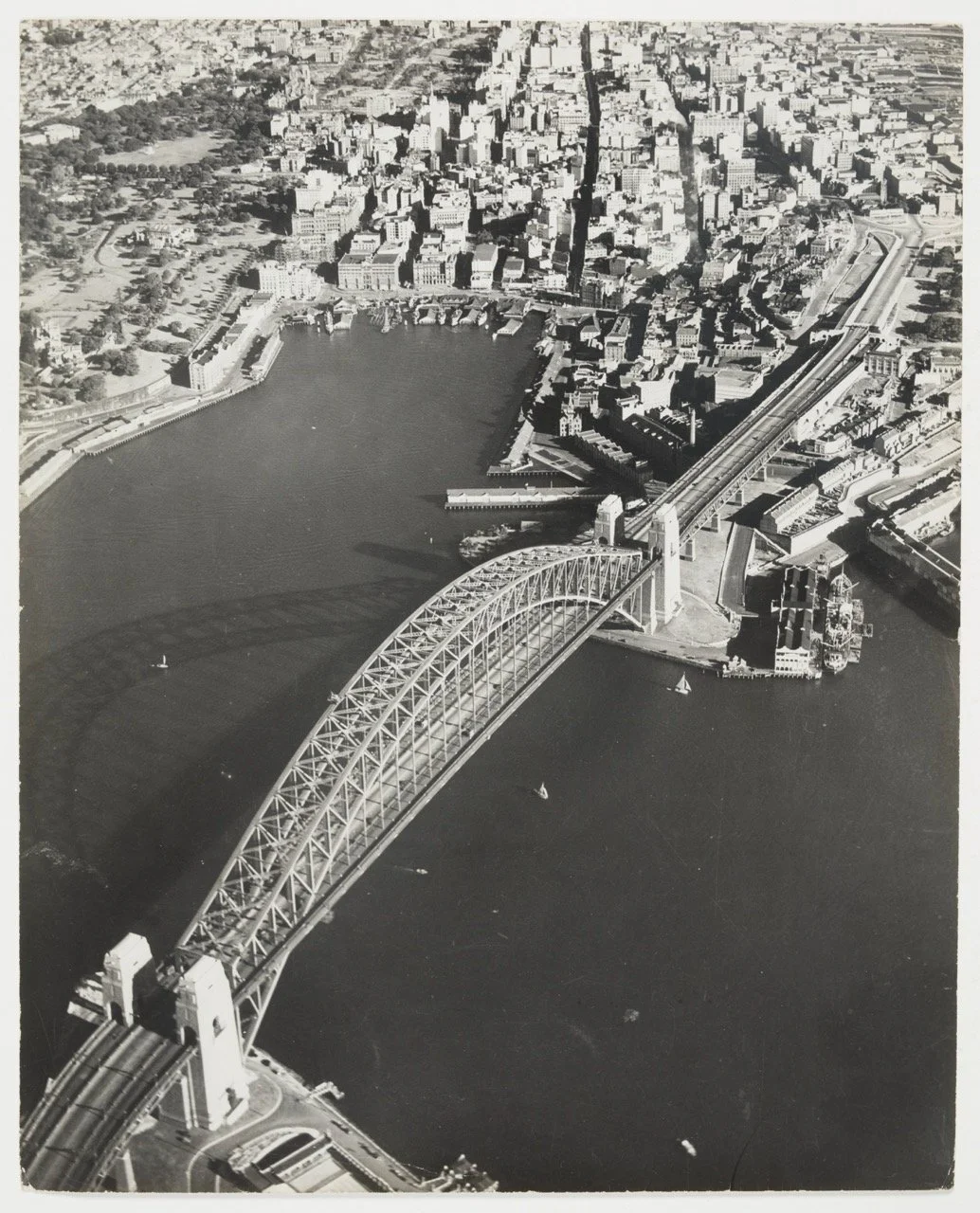 CBD, The Rocks, Sydney Cove, Harbour Bridge and Domain from the air, late 1930's