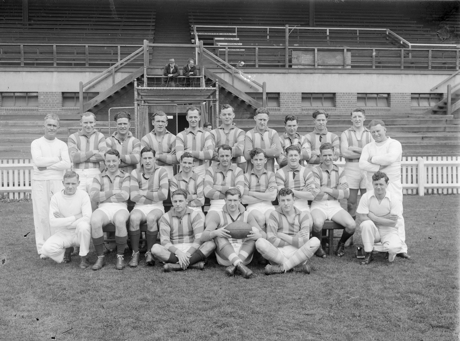 North Melbourne football team in front of empty grandstand, Arden Street 1947