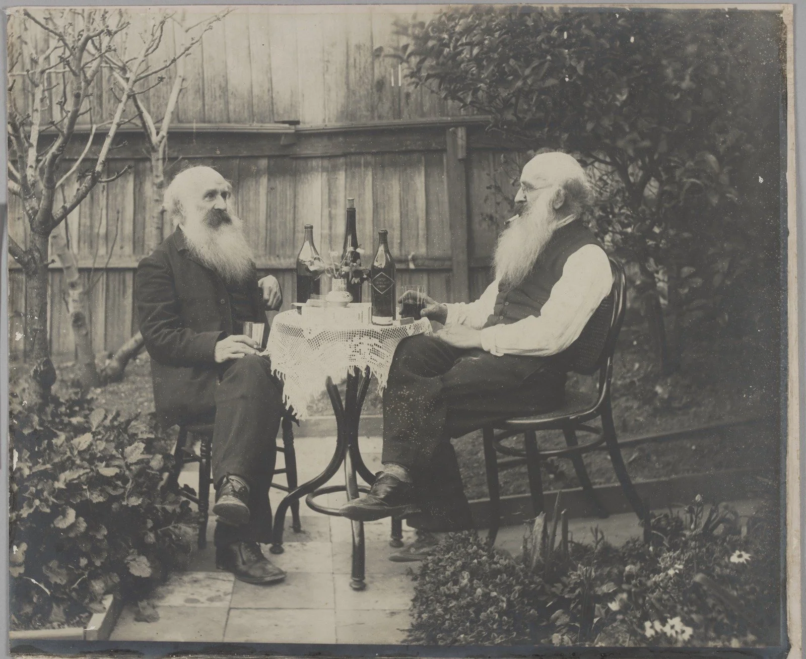 Two men drinking Chateau Yering Wine 1900s 