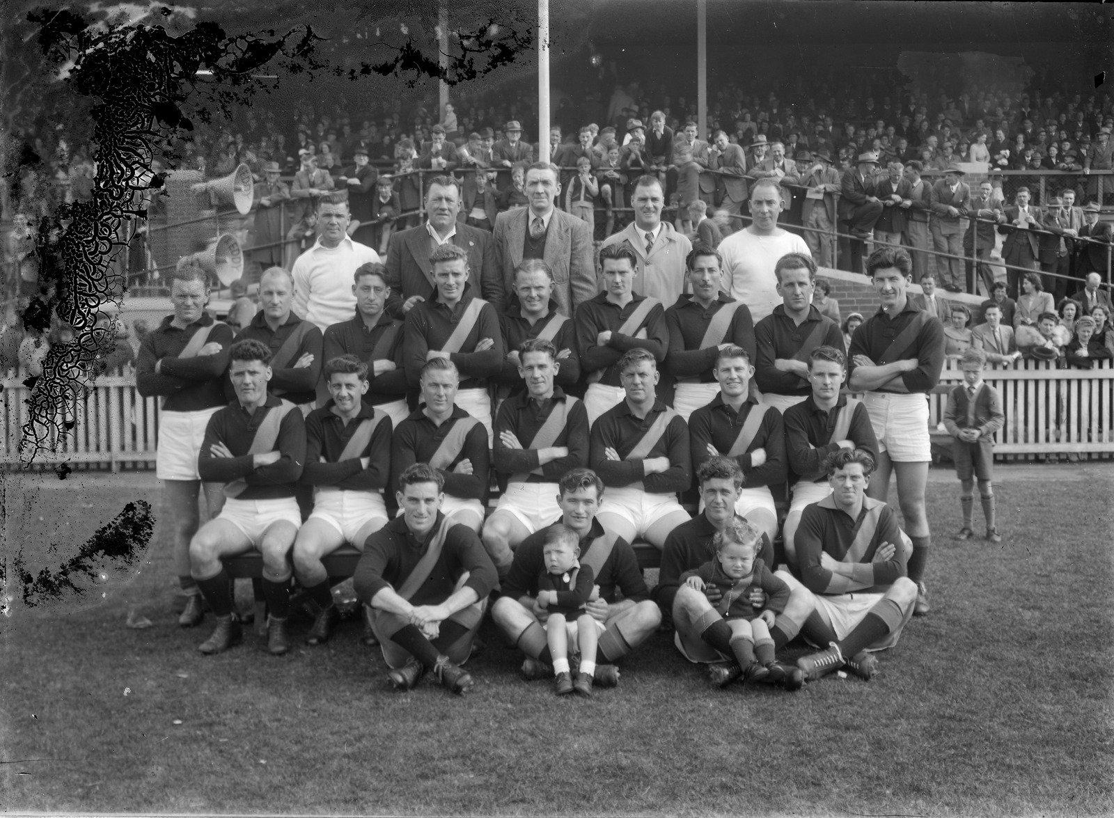 Richmond football team in front of a grandstand 1920s