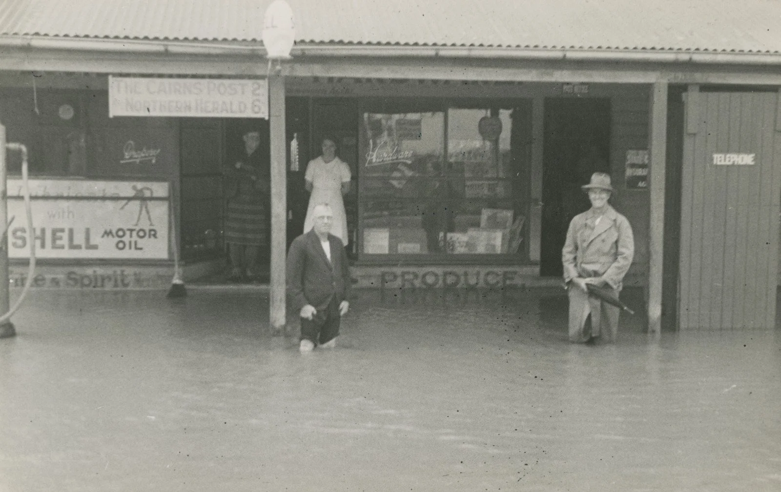 Floodwaters lapping at the doors of the post office and Regent Cafe, Edmonton, ca. 1930
