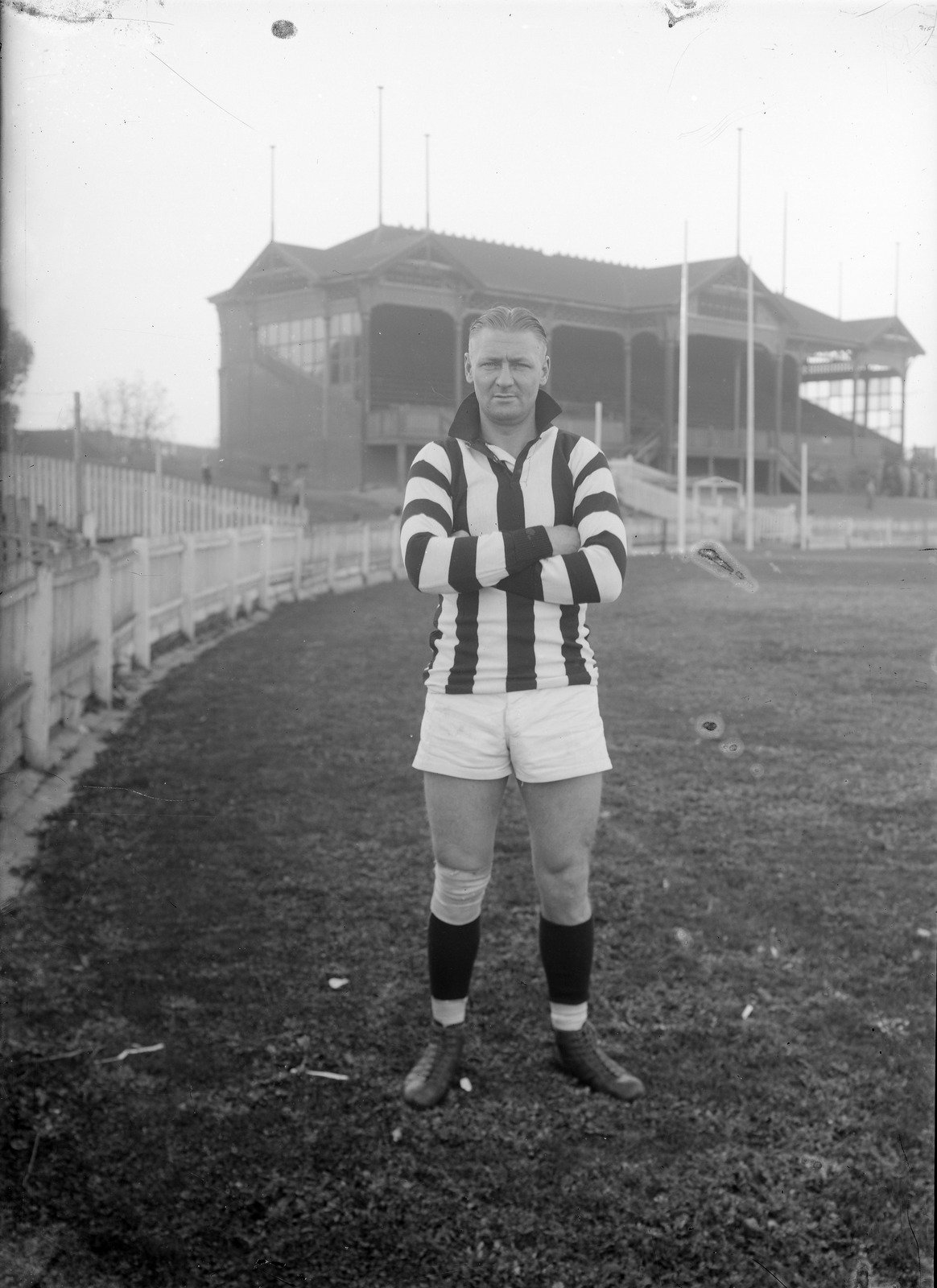 Collingwood football player on an oval 1920s 6
