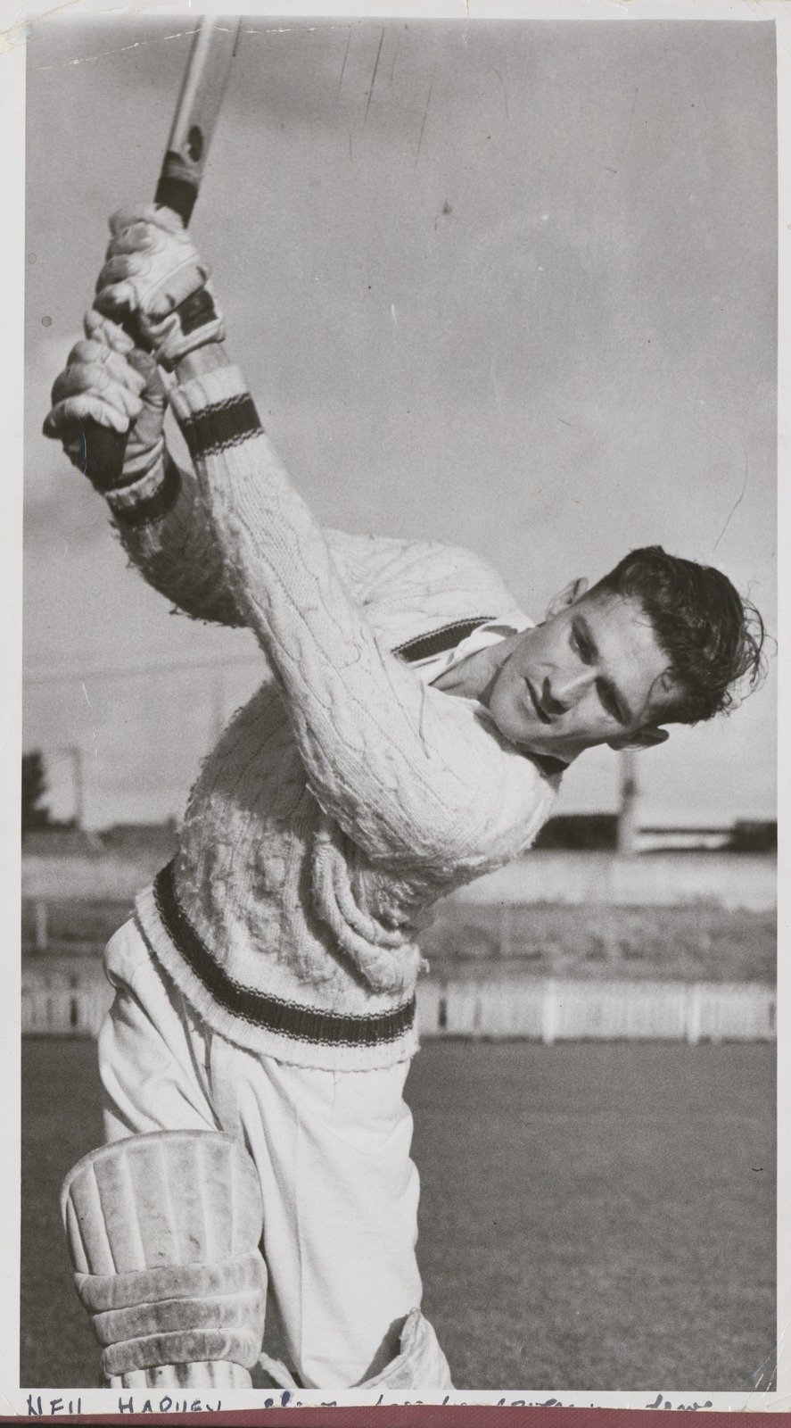 Neil Harvey, with bat, wearing cricket whites 1955 ©