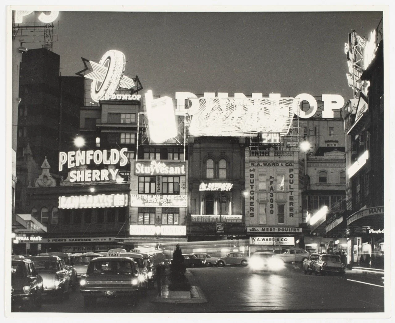 Neon lights and traffic at the Top-of-the-Cross, Kings Cross, 1962-1964