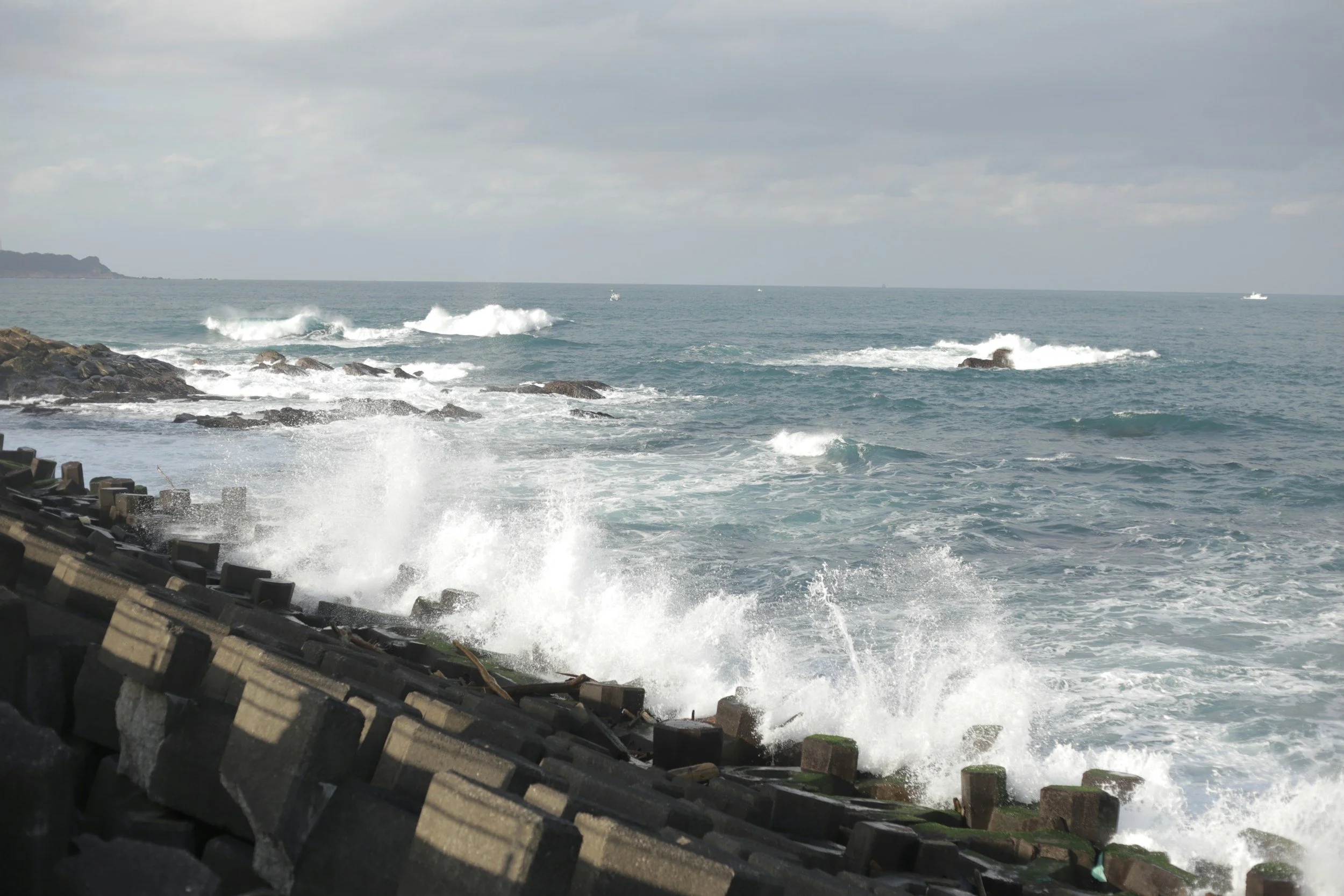 Waves breaking against a coastal sea wall