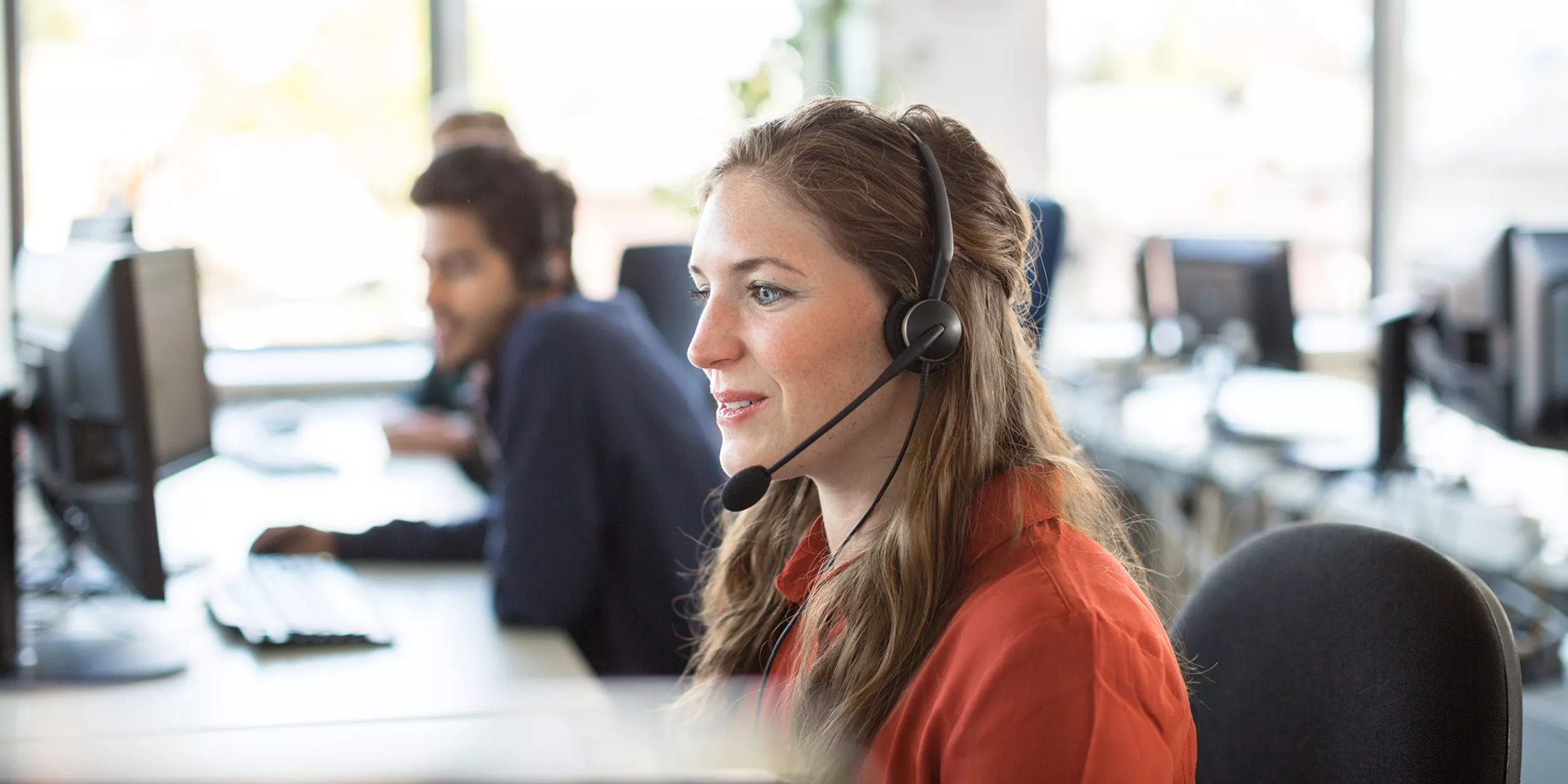 KLM customer care agent working at a service desk
