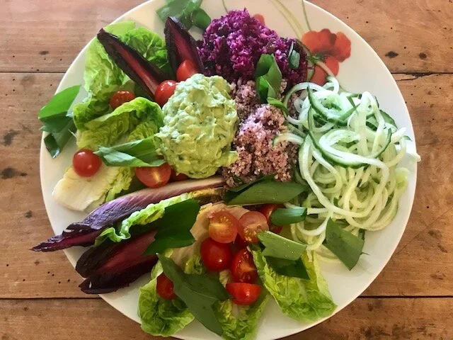 Leafy green salad with tomatoes and cucumber