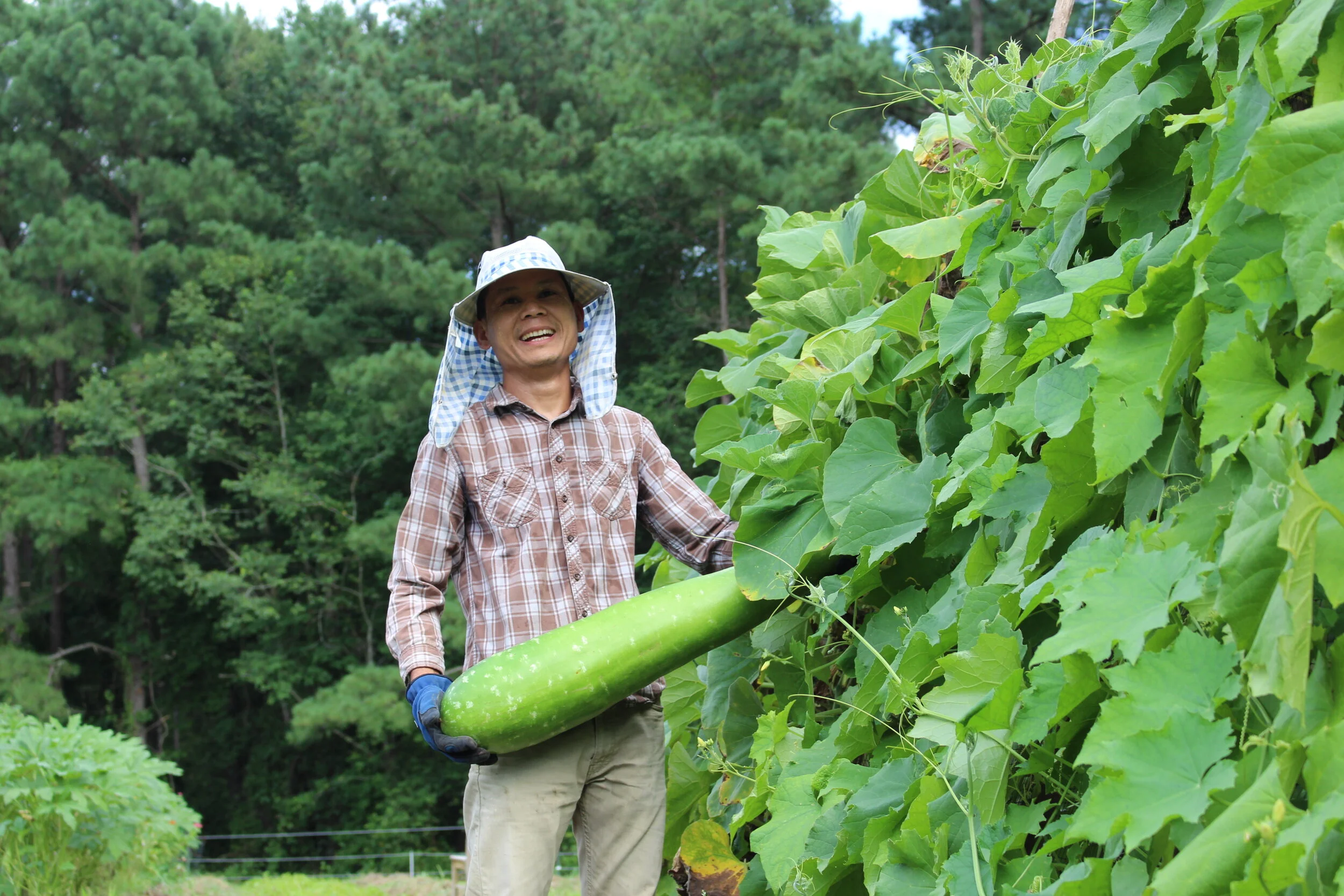 Htoo Saw and a water gourd
(Photo by Dee Shore, NC State University)