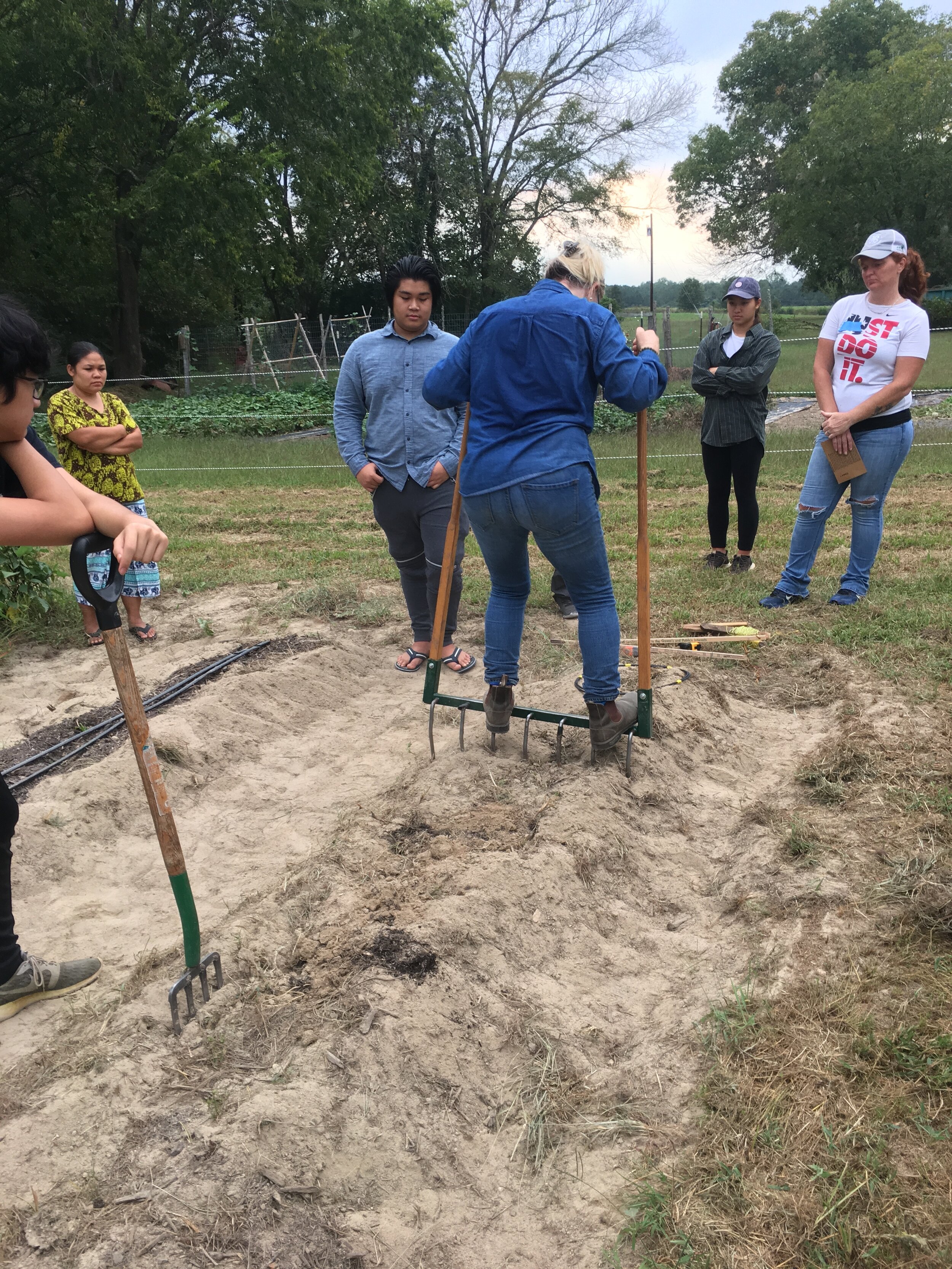 Kay teaching farmers to use a Broadfork