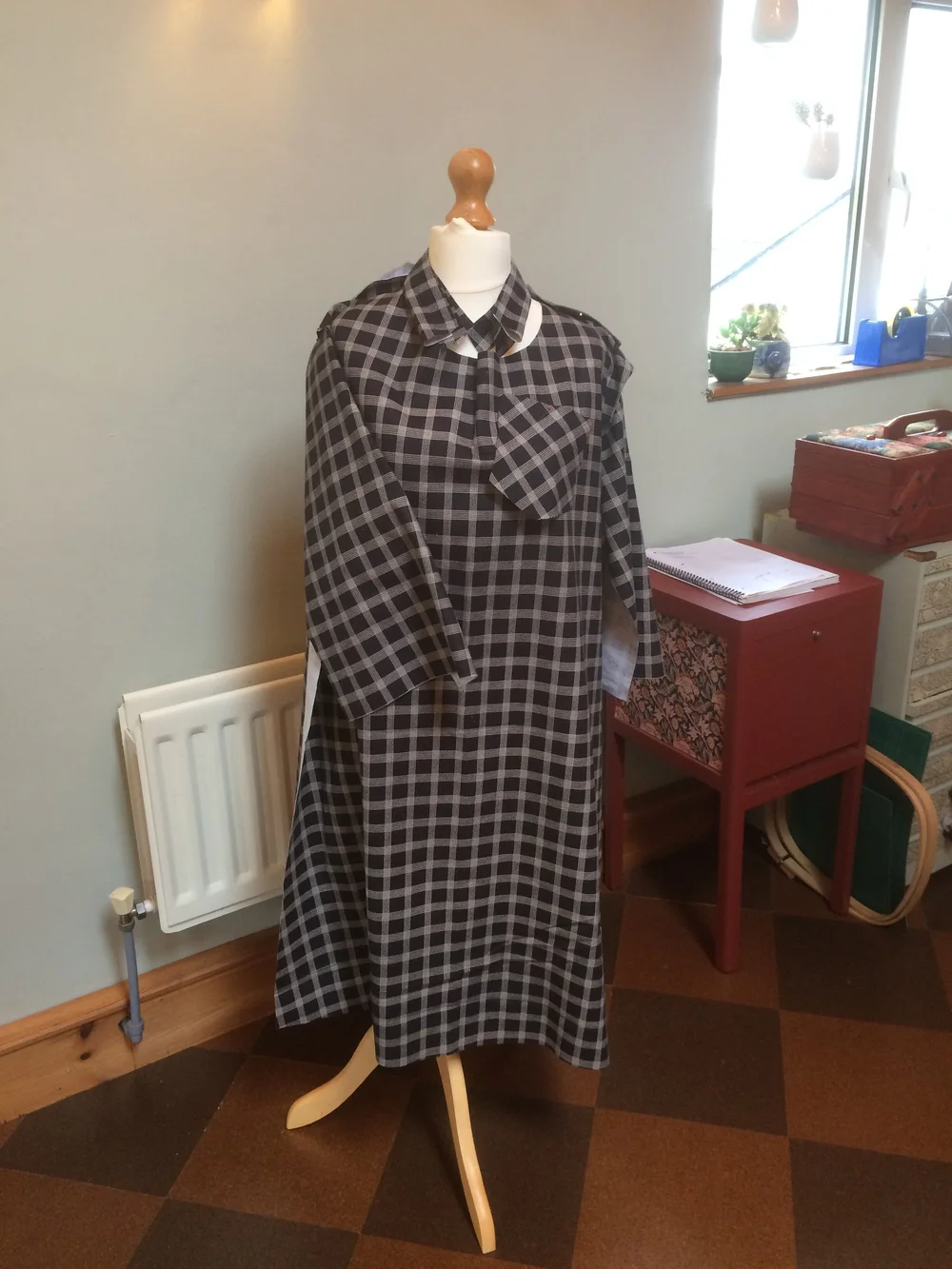 Shirt dress pieces pinned to dummy