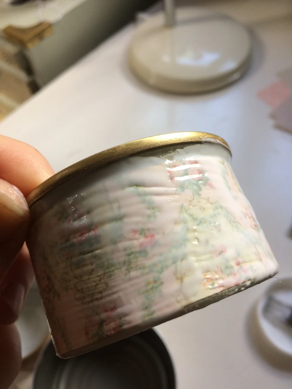 Applying final layer of mod podge to can