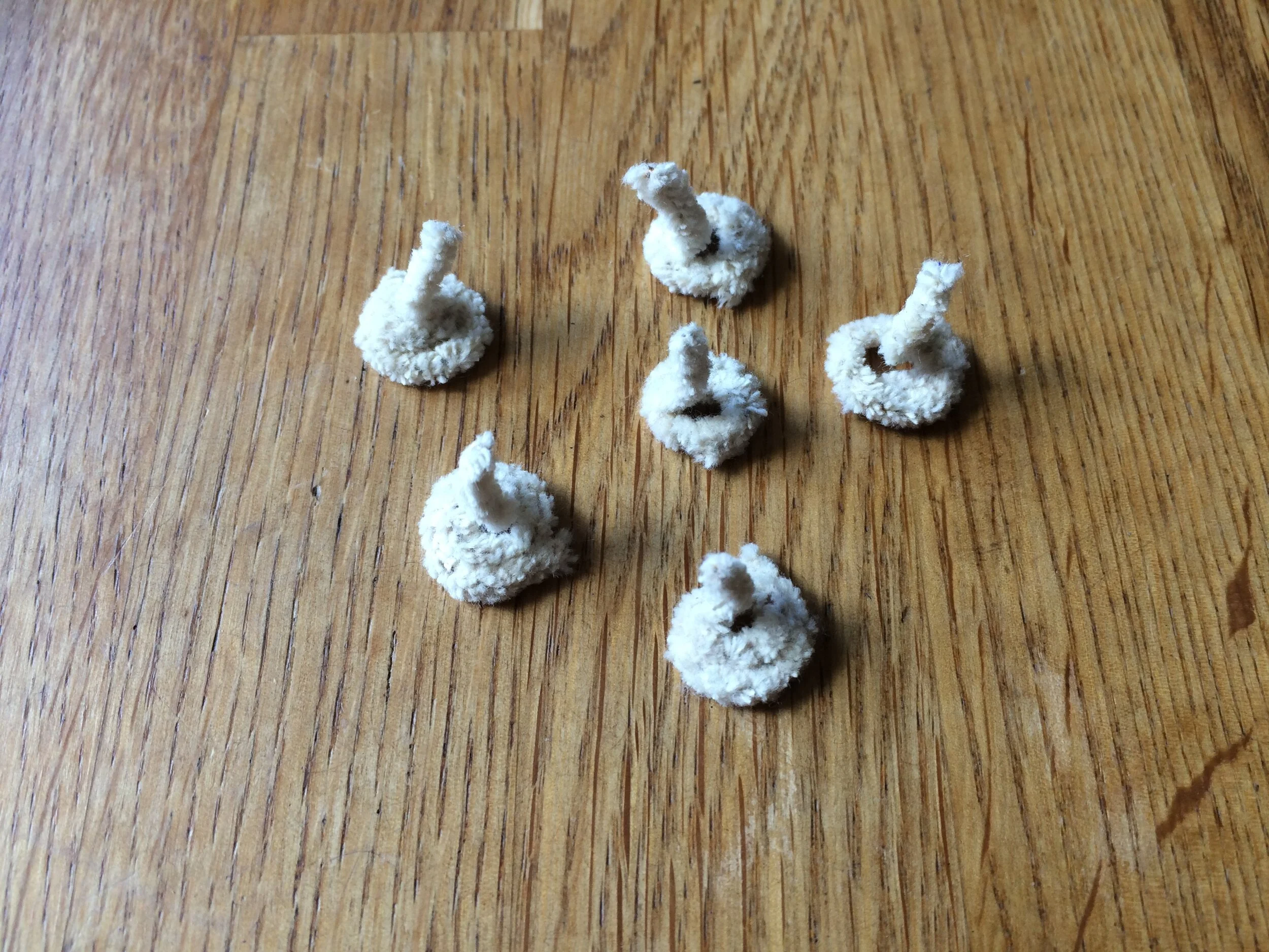 Floating wicks before being dipped in wax