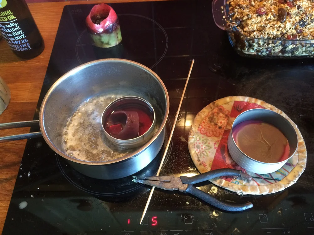 Melting old candles on the stove