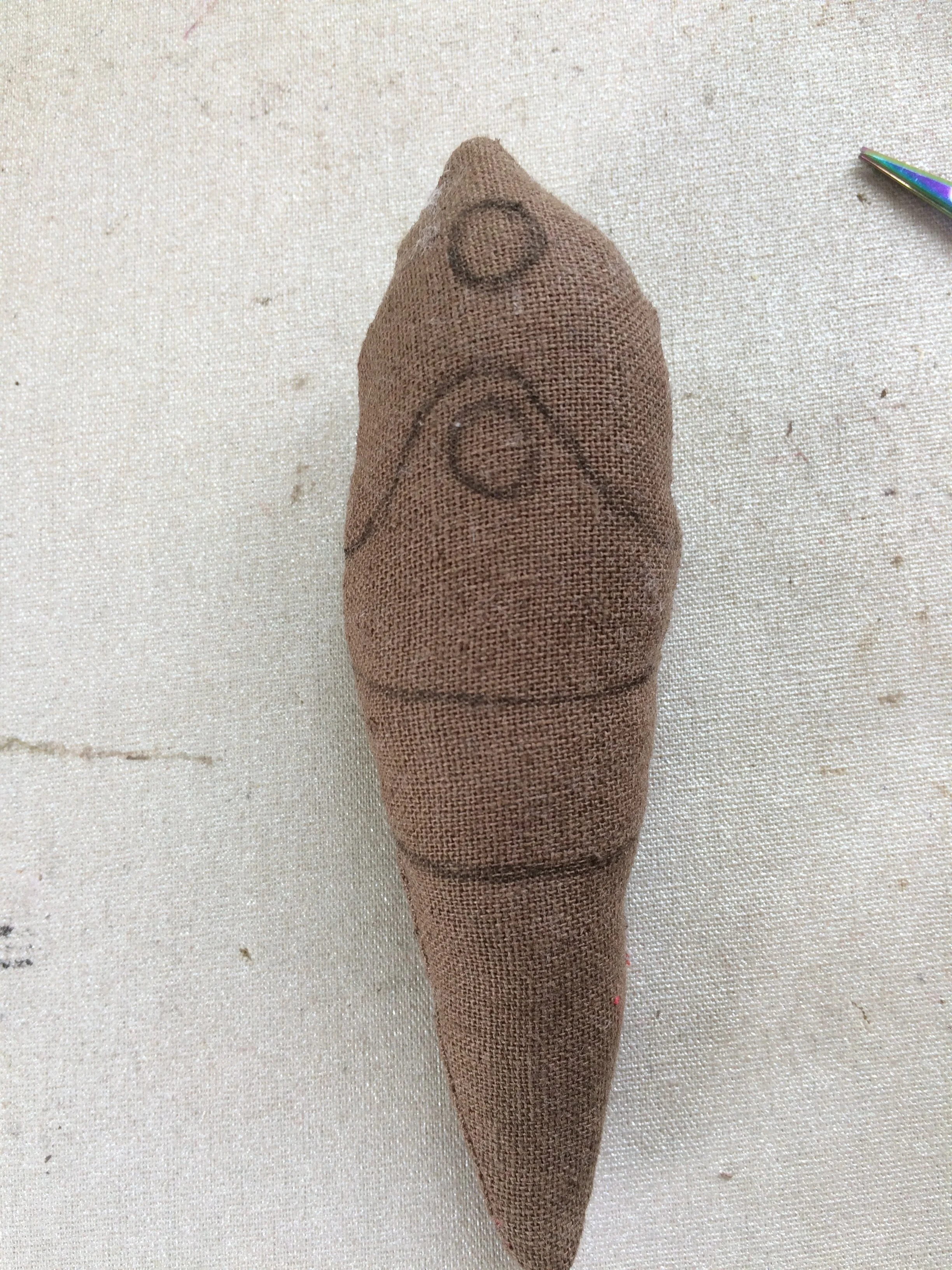 Moth body with embroidery lines drawn on
