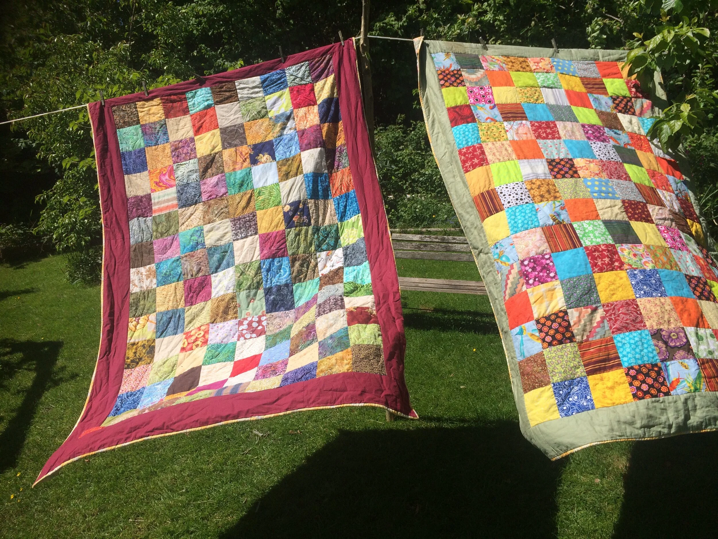 Quilts blowing on washing line