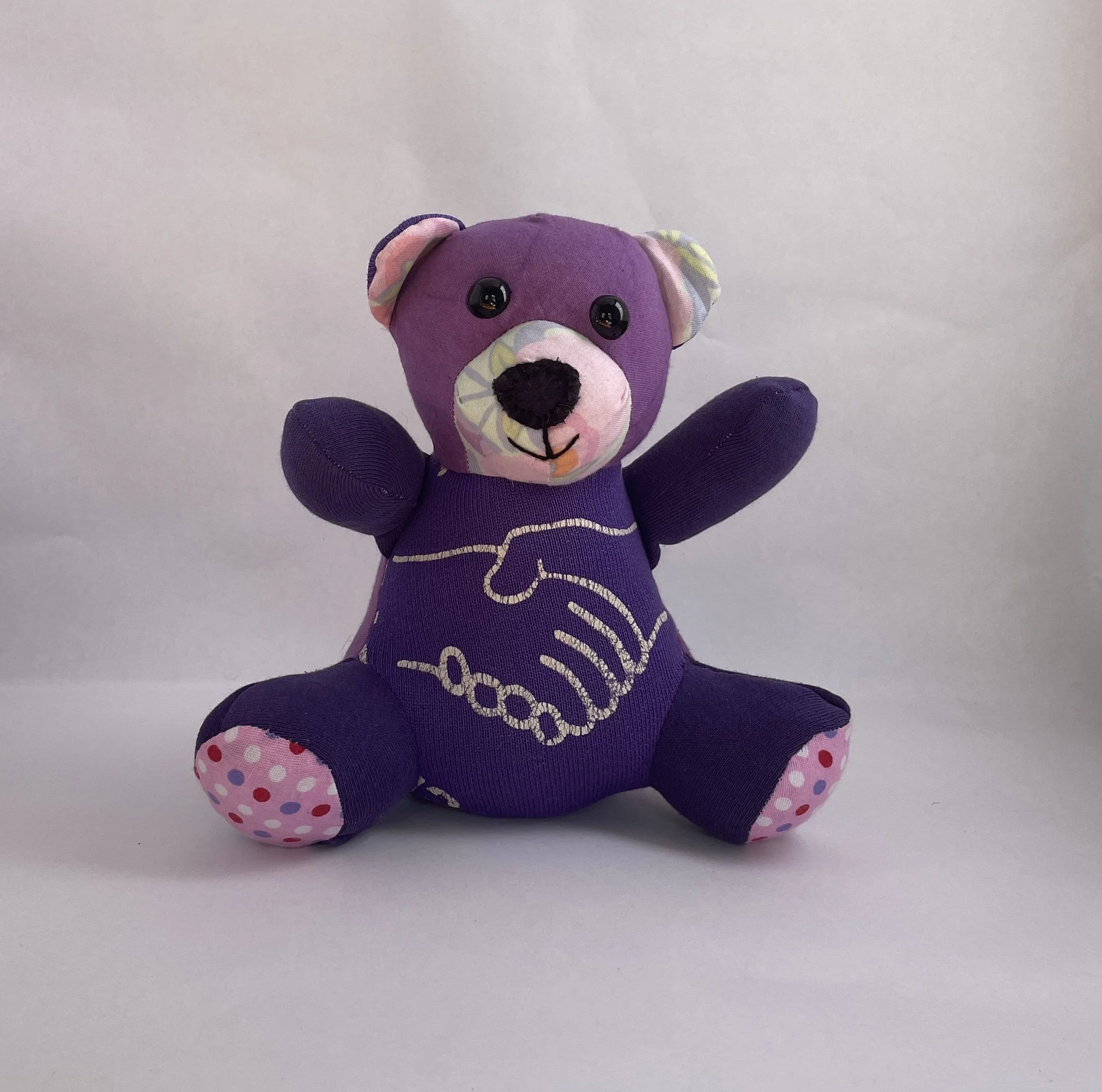 Small teddy bear made from school uniform