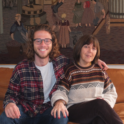 In the living room of my home with my host mother, Marcela. She made the tapestry behind us.