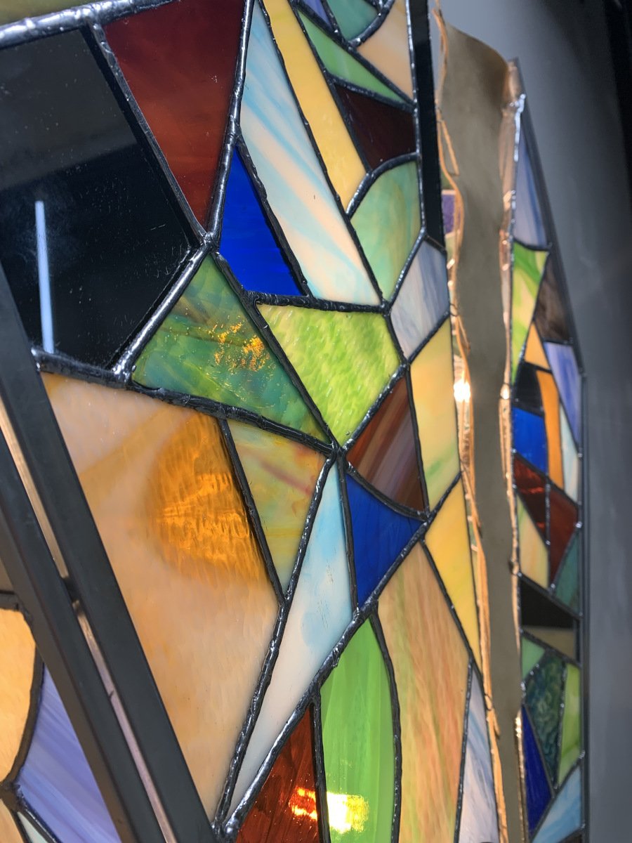 Sconce (detail), 2021, stained glass, leather, wood, bulbs, 22 x 33 x 5 in.