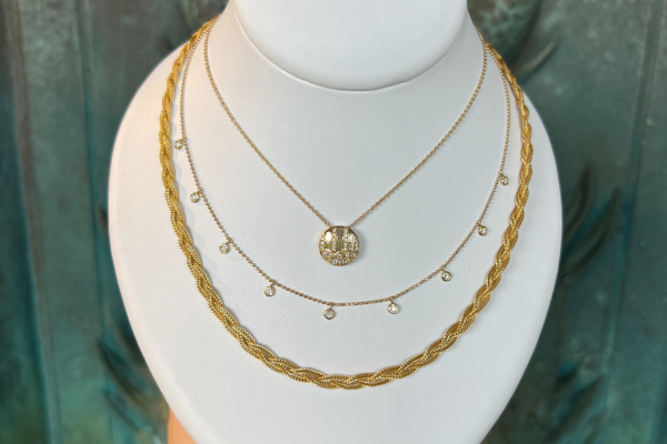 gold layered necklace with medallion.png