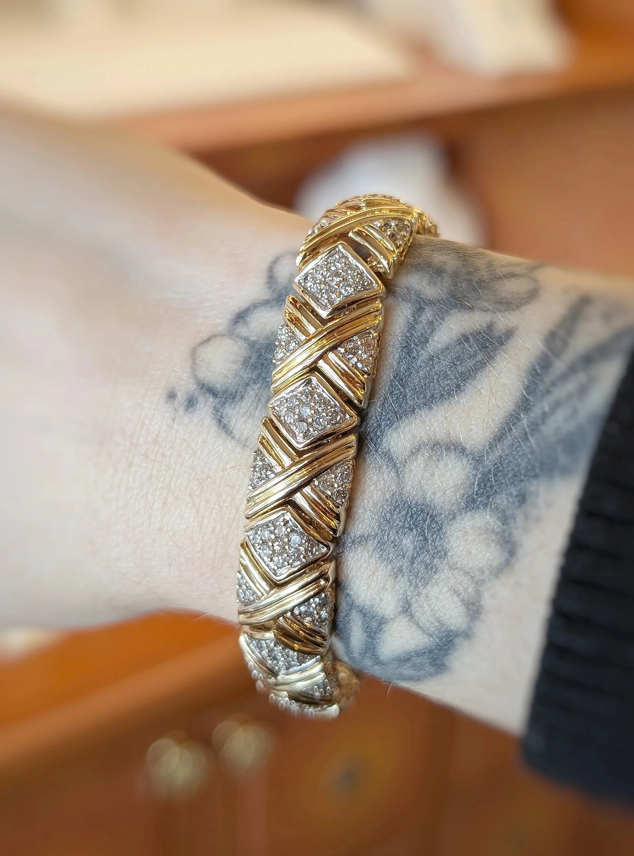 14k yellow gold diamond X motif bracelet with hidden box clasp. 6.75 inches. (170-874)