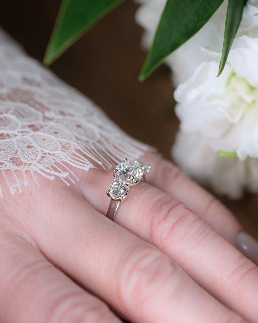 You may have seen the wedding photos, but here&rsquo;s a closer look at the details.

Bridal jewelry is more than a beautiful finishing touch, we see it as a reflection of your love and Adrienne's was just that.

Her platinum three-stone engagement r