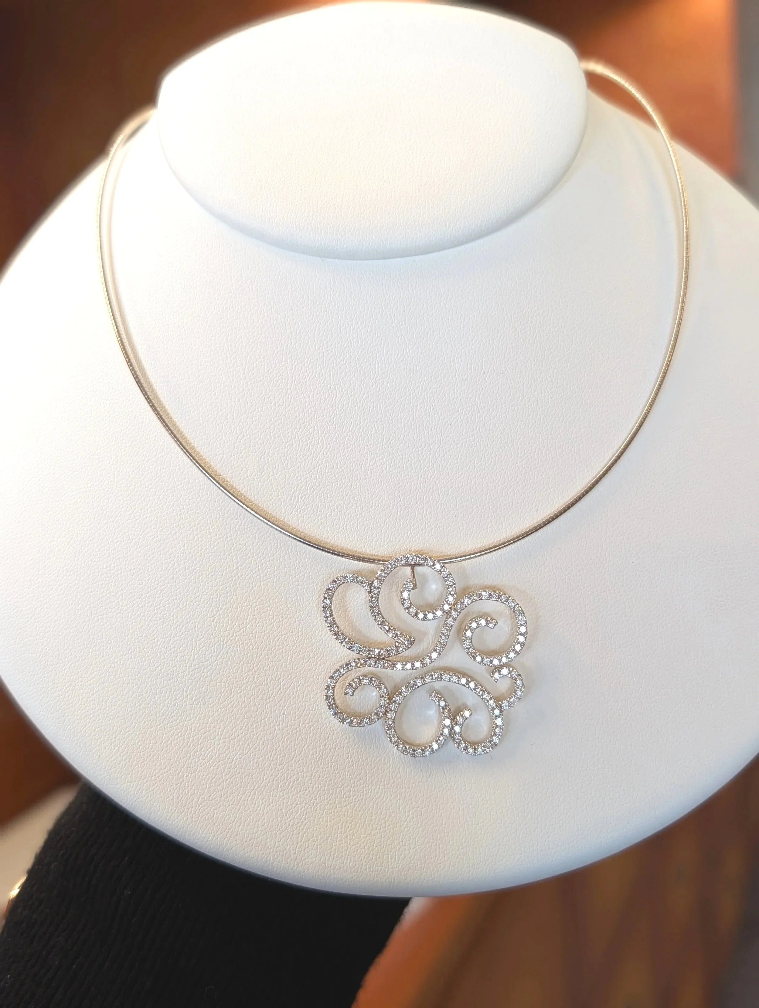 18k white gold diamond cloud pendant on a 16inch 14k white gold omega chain. (160-1619)