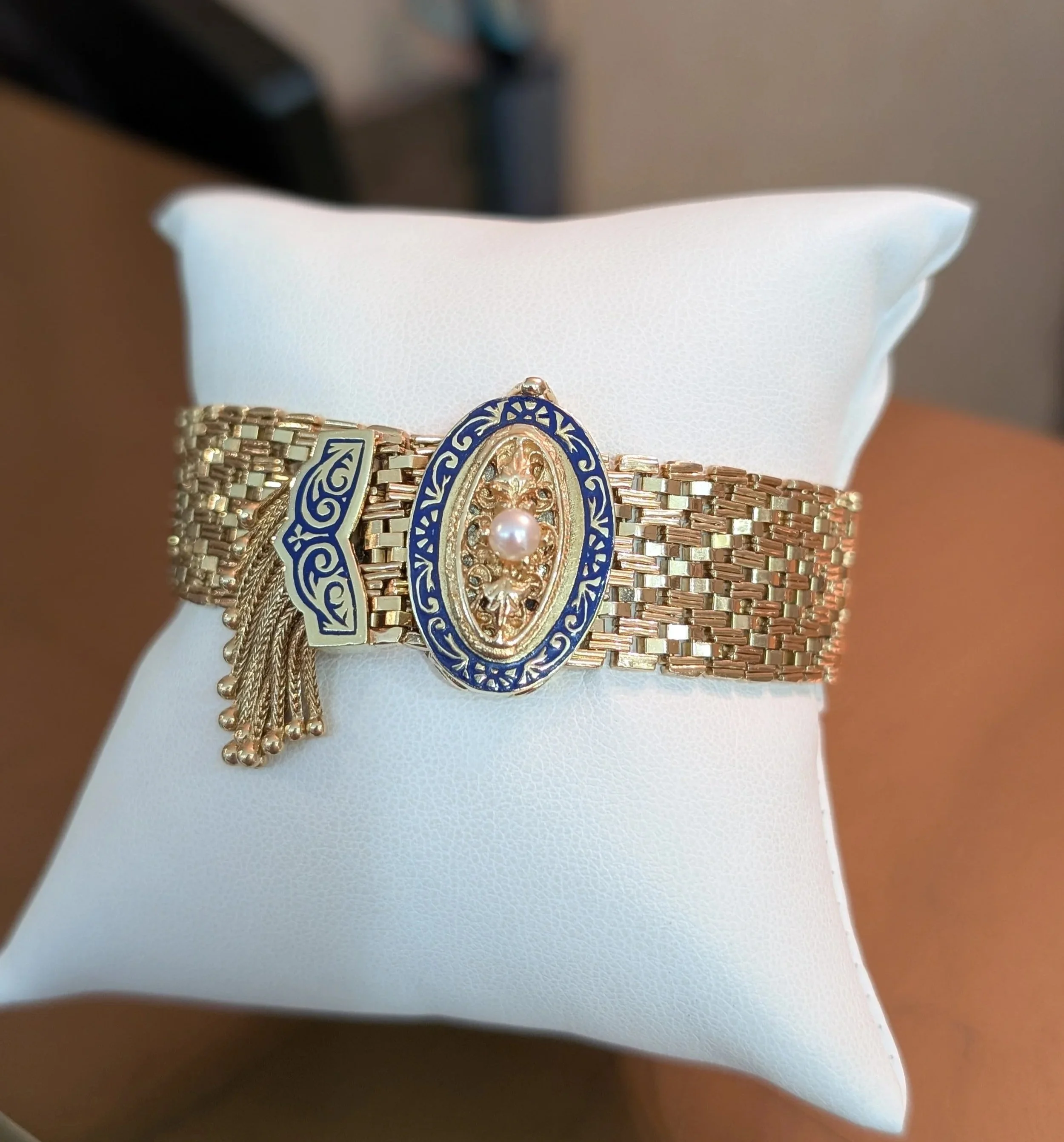 14k yellow gold wide woven mesh link bracelet with blue enamel, pearl, and tassel accents. Size is adjustable! (440-1992)