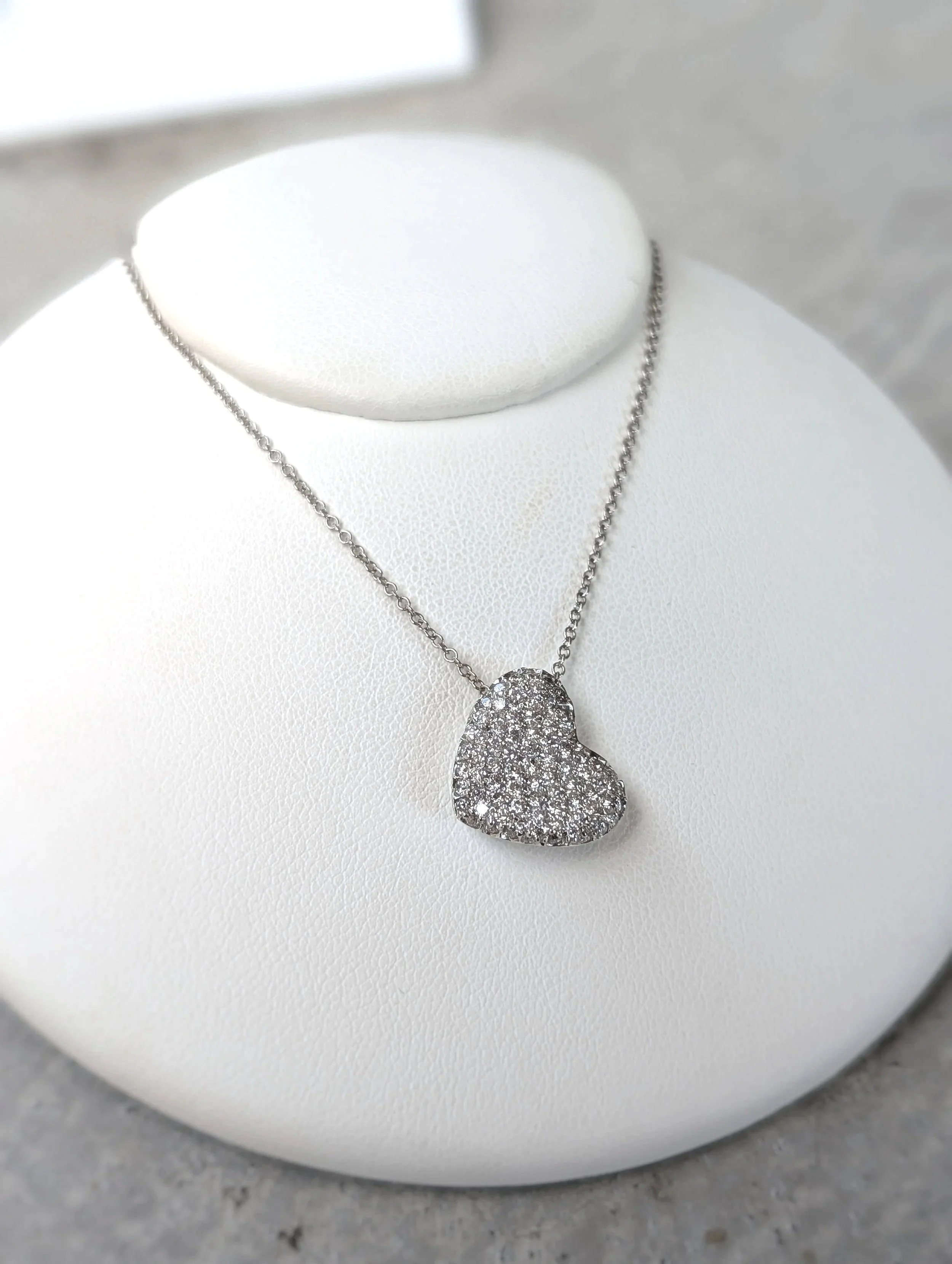 14k white gold pave diamond heart pendant on an 18 inch 14k white gold cable chain. (160-1666)