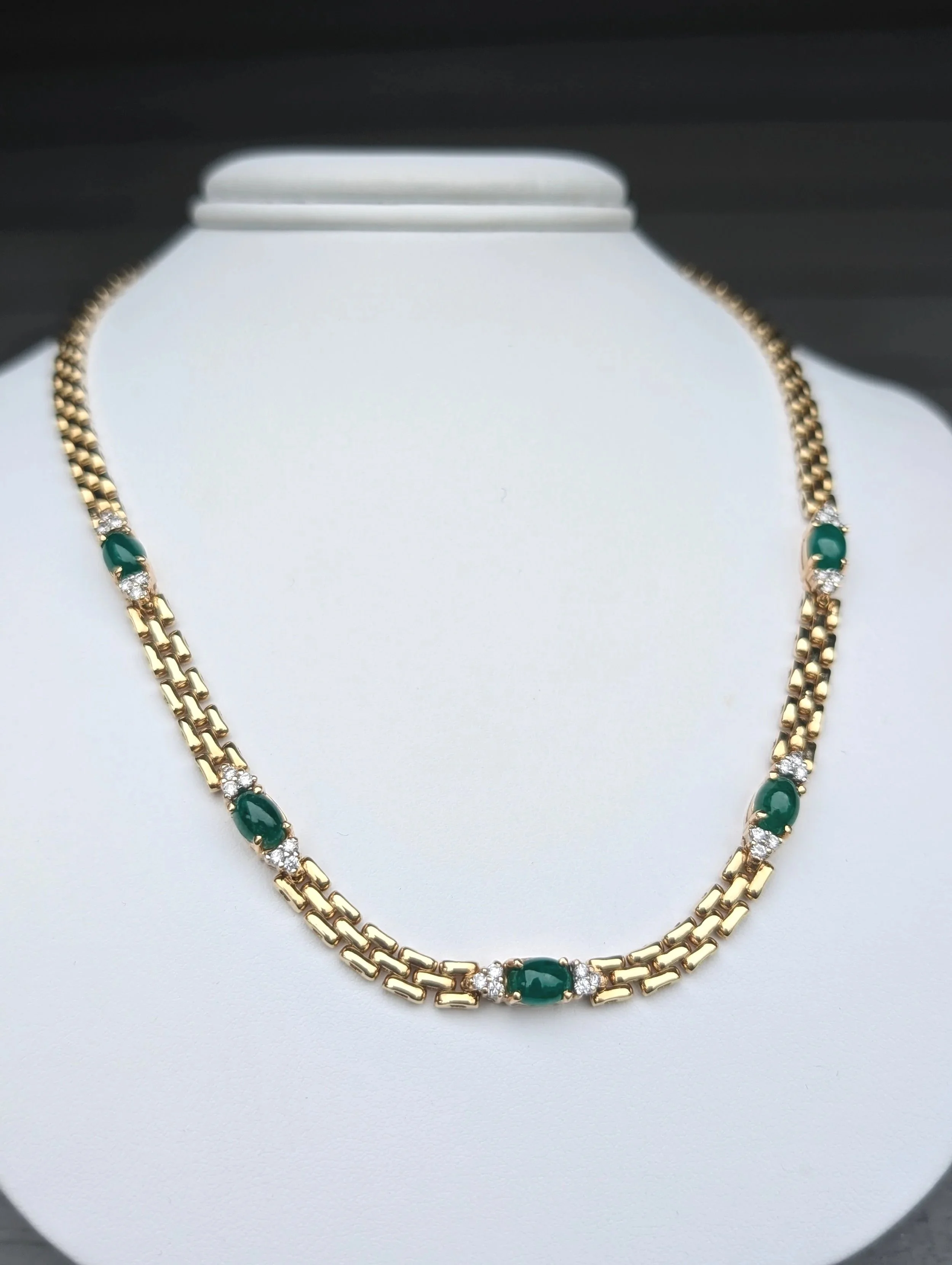 14k yellow gold cabochon emerald and diamond station panther link necklace. (235-2629)