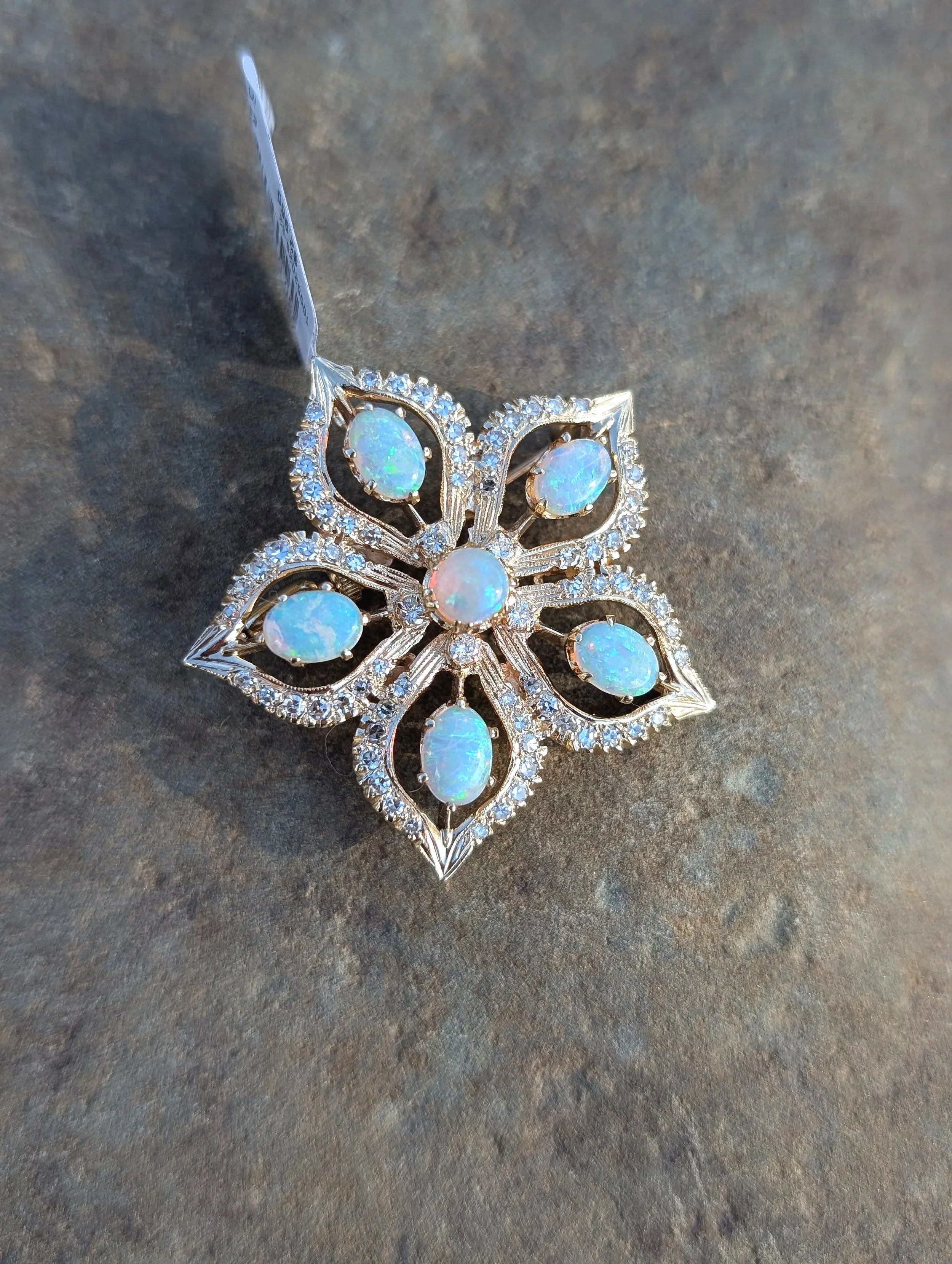 14k yellow gold floral motif opal and diamond brooch/pendant with milgrain detail. (230-1761)