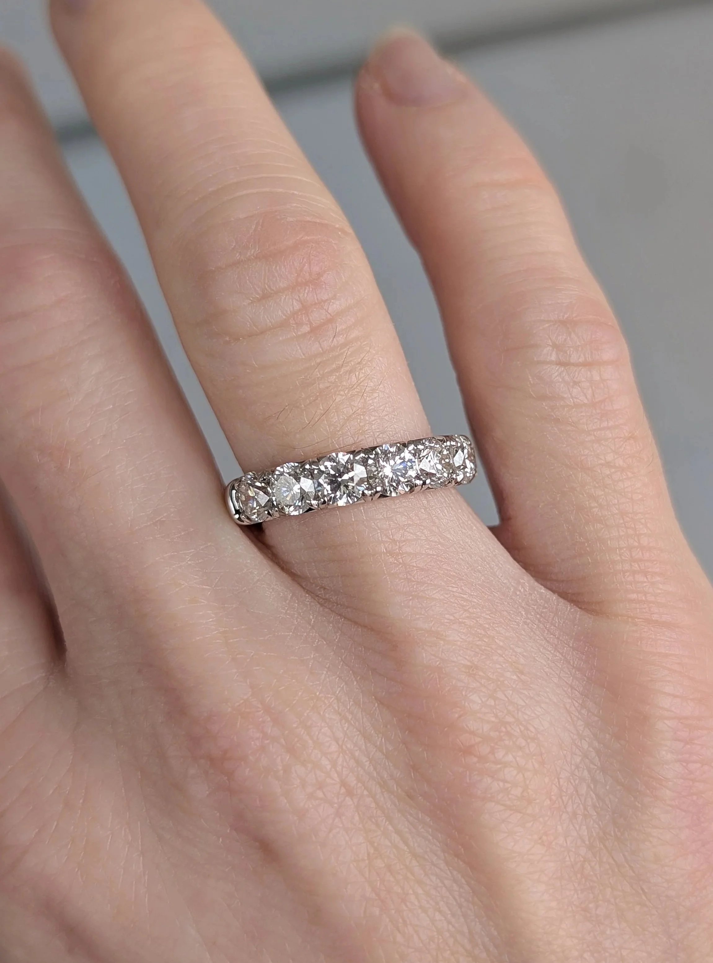 14k white gold MJ Tresor diamond band French set with 7 round diamonds weighing approximately 2.10ctw. Size 6.5. (110-2629)