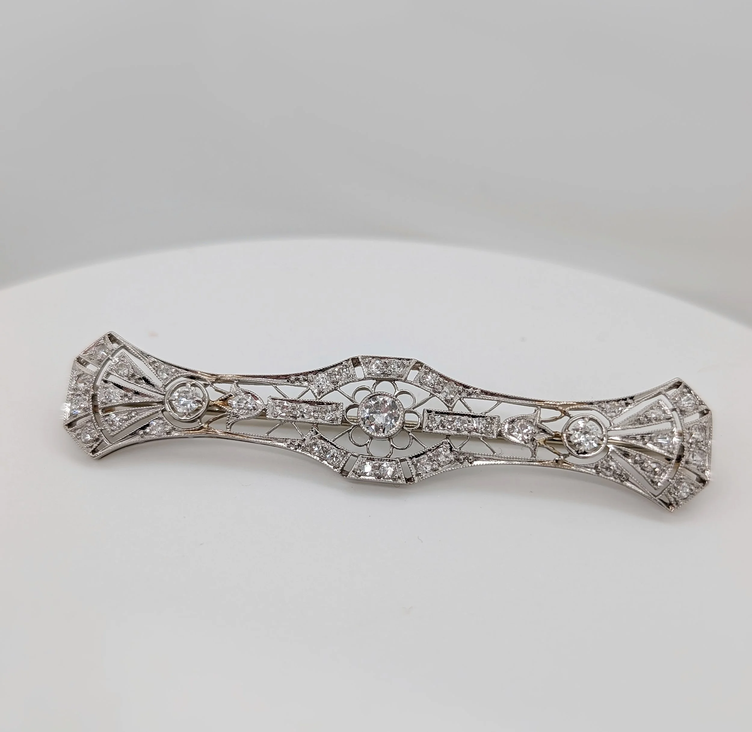 Platinum and 14k yellow gold diamond filigree brooch with 41 Old European cut diamonds weighing approximately 1.00ctw. (180-288)