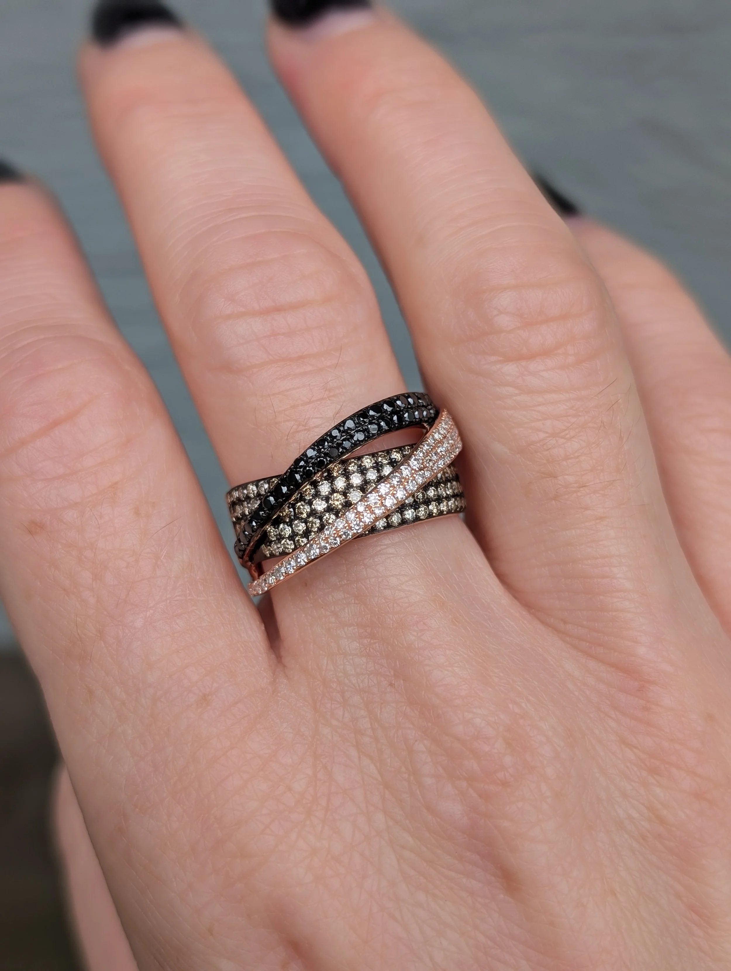 14k rose gold wide crossover ring set with colorless, brown, and black diamonds. Size 7. (130-1274)