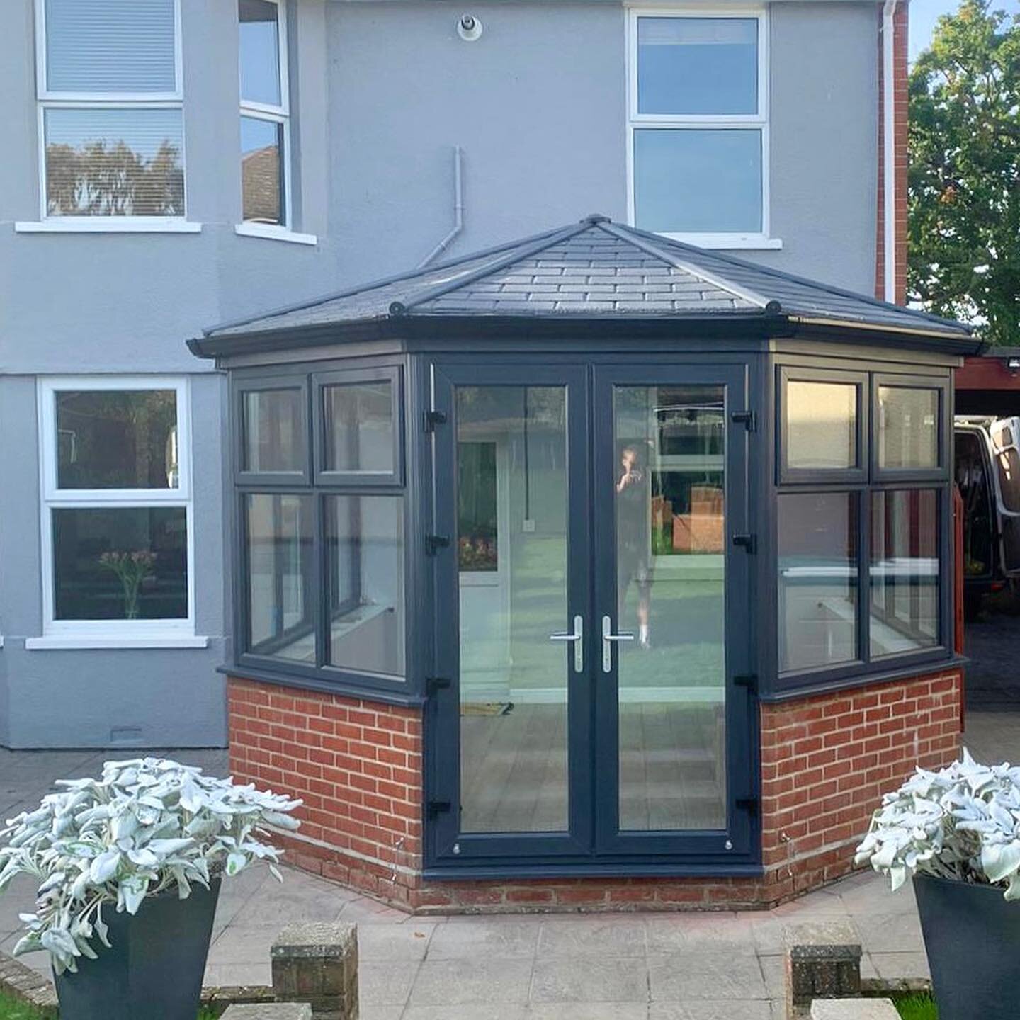 Warm roof conservatory installation. We replaced an old polycarbonate conservatory with this fantastic warm roof making the room useable all year. 
The anthracite grey gives a fantastic contrast.